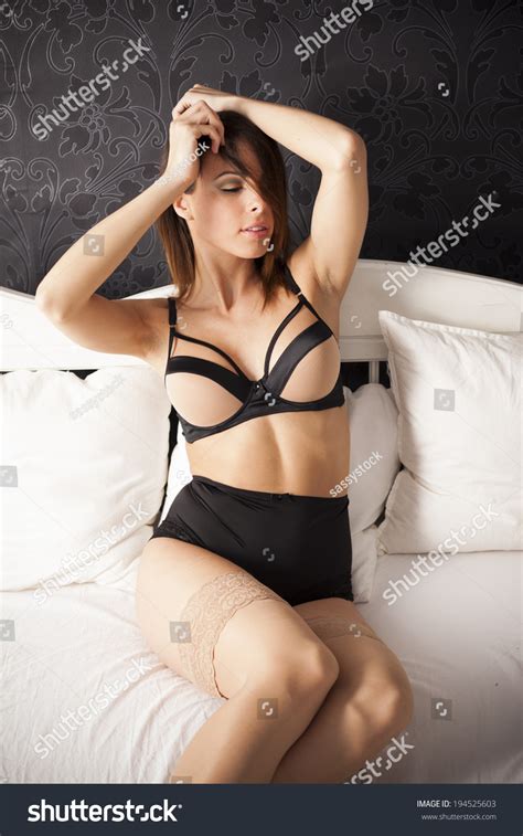 Sexy Brunette Lingerie Woman Laying On Stock Photo 194525603 Shutterstock