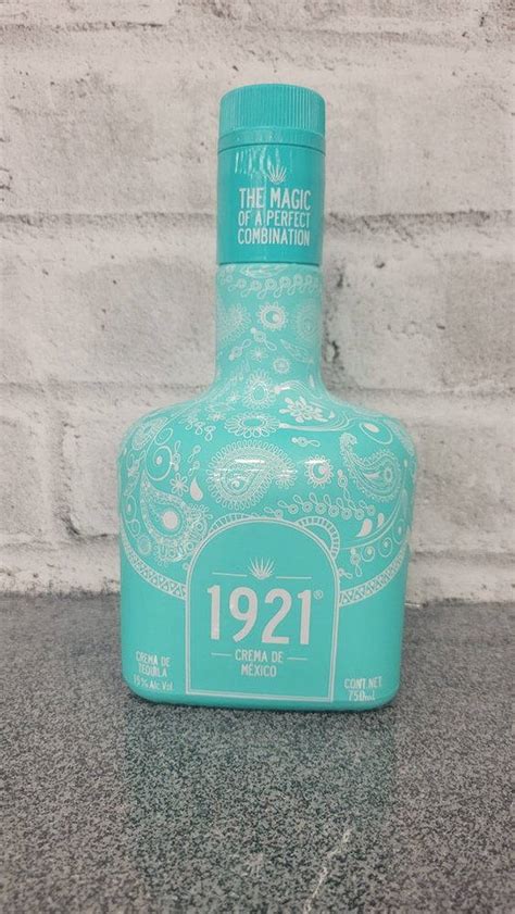 Download 1921 Tequila Azul Maya Bottle Brick Wall Wallpaper