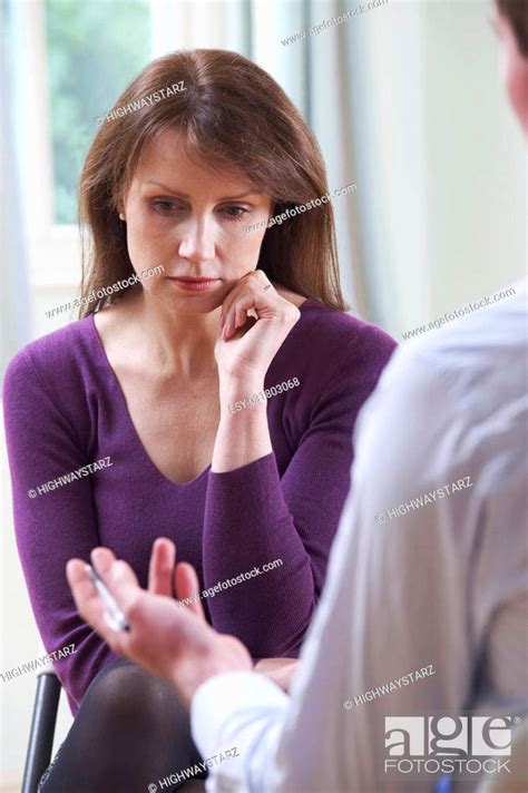 Depressed Mature Woman Talking To Counsellor Stock Photo Picture And