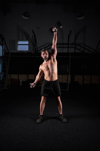Premium Photo Full Length Of Athletic Sportsman With Naked Torso In Short Lifting Heavy