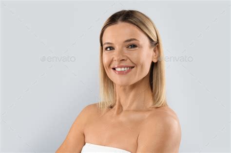 Portrait Of Attractive Half Naked Middle Aged Blonde Woman Copy Space Stock Photo By Prostock