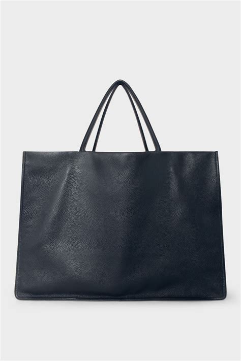 navy blue leather bags