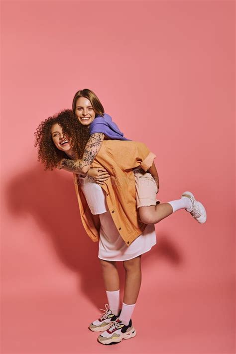 Cheerful Lesbian Couple Shares Joy And Stock Photo Image Of Pink Love