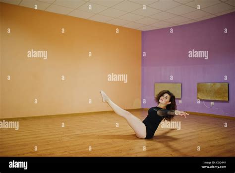 Curly Brunette Plus Size Model Doing Acrobatic At Dance Room Stock