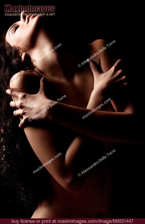 Nude Woman Holding Crossed Arms Around Her Chest Stock Photo MXI31447