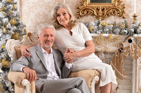 Couple Old And Mature Seniors Enjoying And Having Fun Together Celebrating The New Year Stock