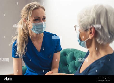 The Importance Of Regular Checkups Clever Blonde Doctor Helping Her Older Patient High Quality