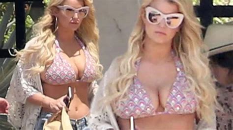 Jessica Simpson Squeezes Boobs Into Pink Bikini As She Suns Herself In