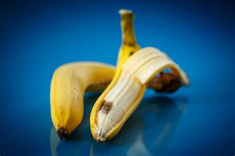 Erotic Banana And Donut In The Hands As A Symbol Of The Penis And Vagina Isolated On A Pink