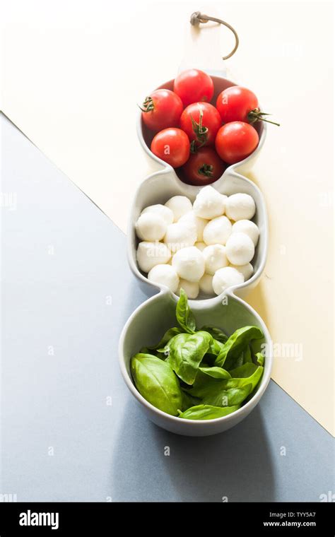 Mozarella Cheese Balls Fresh Basil Leaves And Round Cherry Tomatoes