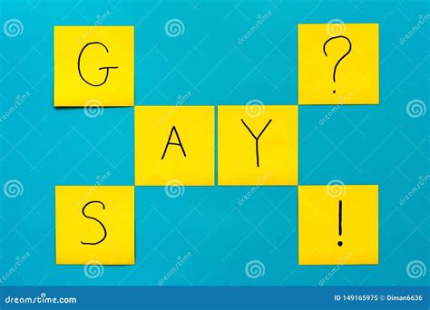 Handwritten Black Inscription Gay And Say On Yellow Square Stickers On A Blue Background Stock
