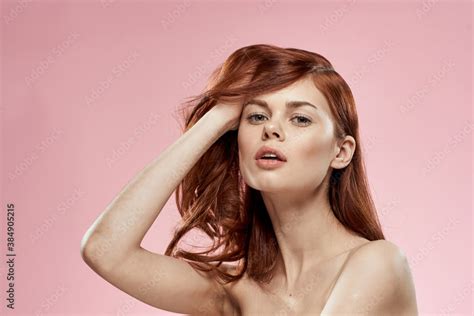 Pretty Woman With Long Beautiful Hair Grooming Hairstyle Glamor Naked Shoulders Pink Background