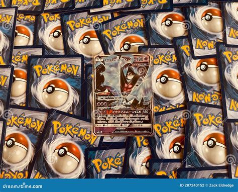 A Pile of Pokémon Trading Card Game with Holographic Figure Editorial