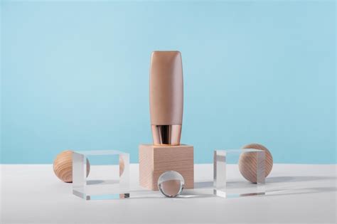 Premium Photo Cosmetic Liquid Foundation Nude Cream Tube Mockup On Acrylic And Wooden Block