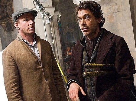 Director Guy Ritchie and Robert Downey Jr. confer while filming the ...