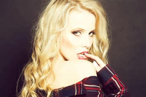 Closeup View Of One Attractive Sexual Passionate Blonde Woman With Long Curly Hair Standing In