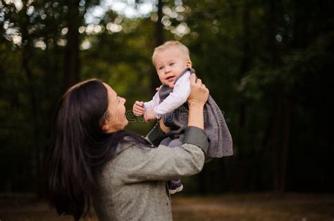 Happy Brunette Mother Playing With A Smiling Baby Daughter Stock Image Image Of Healthy