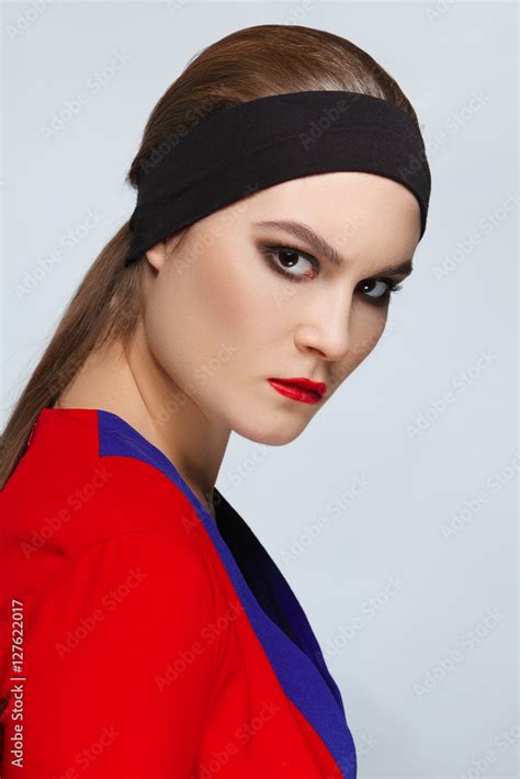 Pretty Brunette Woman In Dressing Gown Wearing Band On Her Head Stock Photo Adobe Stock