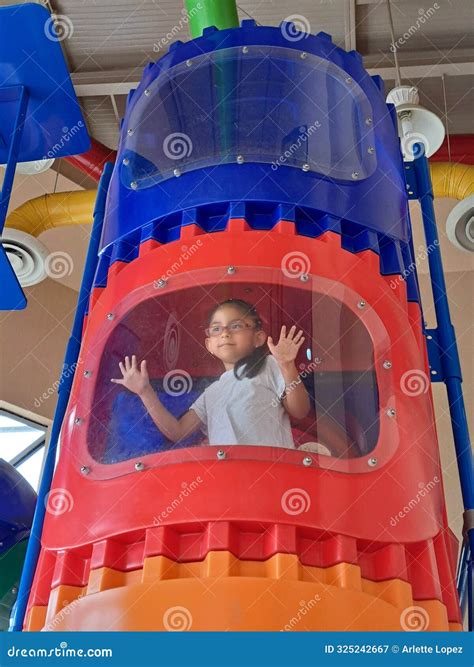 Year Old Brunette Girl With Glasses Climbs Games To Test Her Ability And Develops Motor Skills