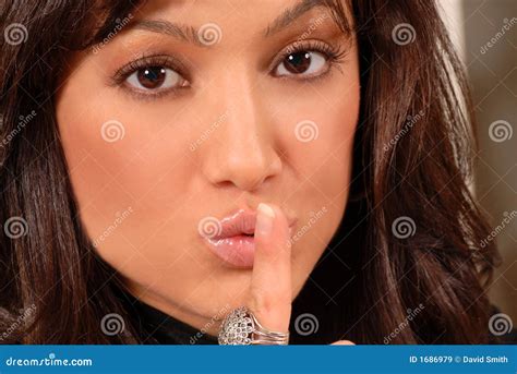 Attractive Brunette With Her Finger To Her Lips Stock Image Image Of Face Girls 1686979