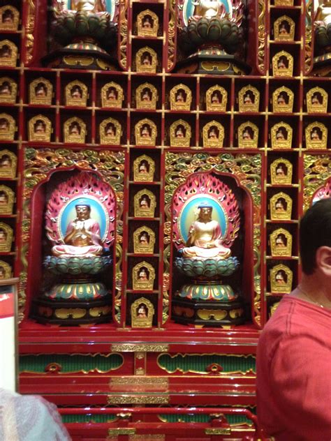 interior of Buddist temple, walls are covered with one hundred buddahs