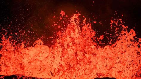 Breathtaking photos show wall of lava erupting from volcano on Iceland ...