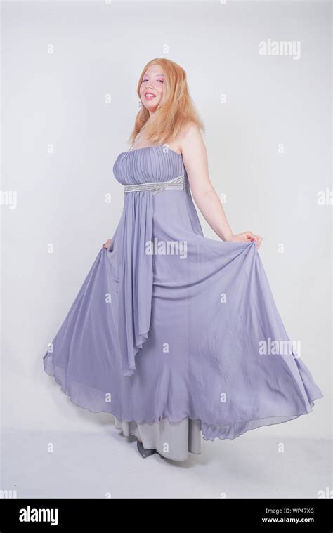 Cute Fashion Lady With Asian Face And Blonde Hair In Gray Dress Stock