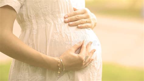 Image Of Pregnant Woman Touching Her Belly With Hands Stock Image Image Of Maternity Body