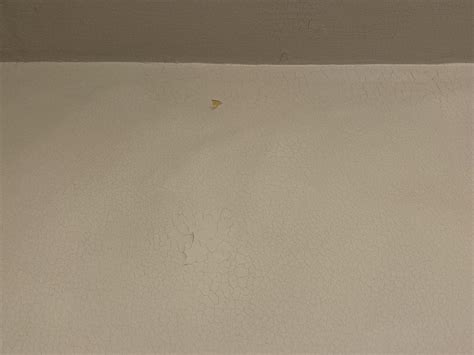 How to prep these chipped paint / cracking walls for painting? : r/howto
