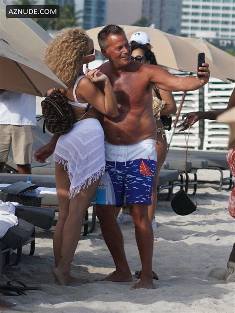 Jasmine Sanders Wears A White Bikini With A Matching Wrap At The Beach With Friends In Miami