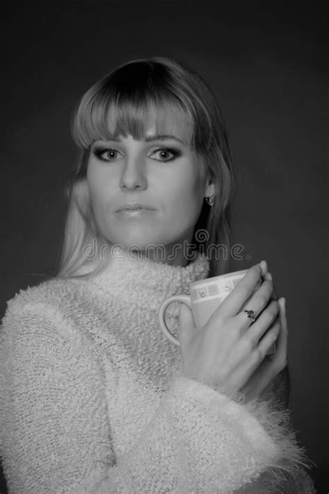 Beautiful Long Haired Blonde In A Studio With A Cup In Her Hands Stock Photo Image Of Cold