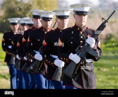 A Marine Corps Honor Guard Prepares To Fire A Salute During A Ceremony