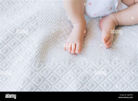 little newborn baby feet on white background Stock Photo - Alamy