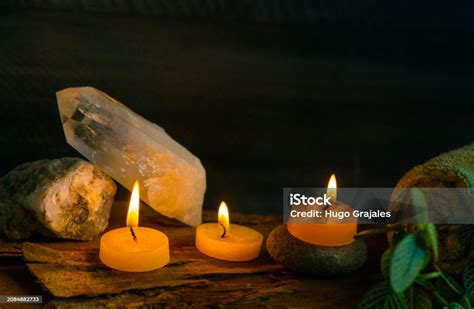 lighted candles    quartz stone   massage  therapy