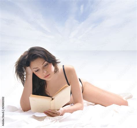 Sexy Brunette In Lingerire Reading A Book Stock Photo Adobe Stock