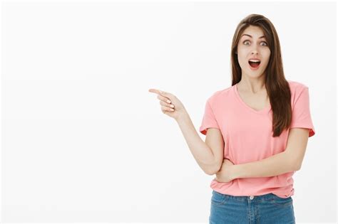 Free Photo Portrait Of Surprised Brunette Woman Posing In The Studio