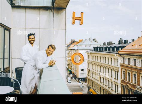 Smiling Gay Couple Enjoying In Hotel Balcony Stock Photo Alamy