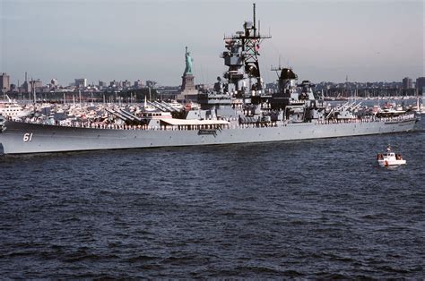 Crew Members Man The Rail Aboard The Battleship Uss Iowa Bb During