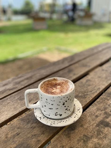 Premium Photo Hot Coffee Cup On Wooden Table