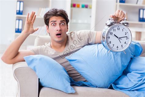 Man Struggling To Wake Up With Alarm Clock Picture Picture And Hd Photos Free Download On Lovepik