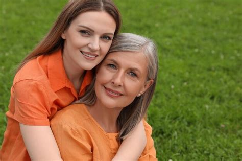 Premium Photo Happy Mature Mother And Her Daughter Outdoors