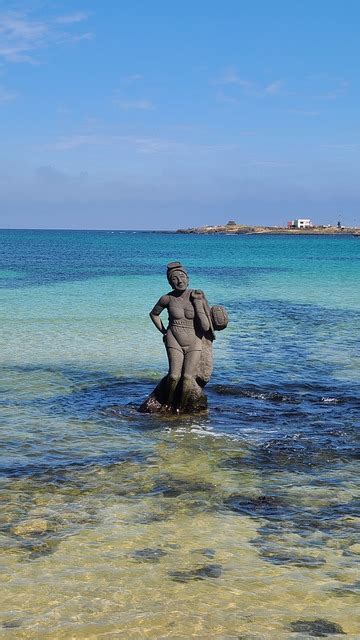 statue sea beach  photo  pixabay