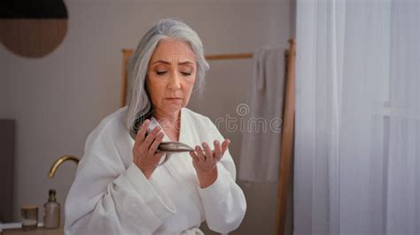 Caucasian Old Senior Mature Woman Lady S Grandmother Model In Bathrobe In Bath Touching Gray