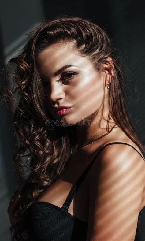 Close Up Of The Seductive Face Of The Brunette With Beautiful Makeup And Lips Luxurious