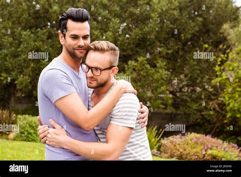 Smiling Gay Couple Hugging Stock Photo Alamy
