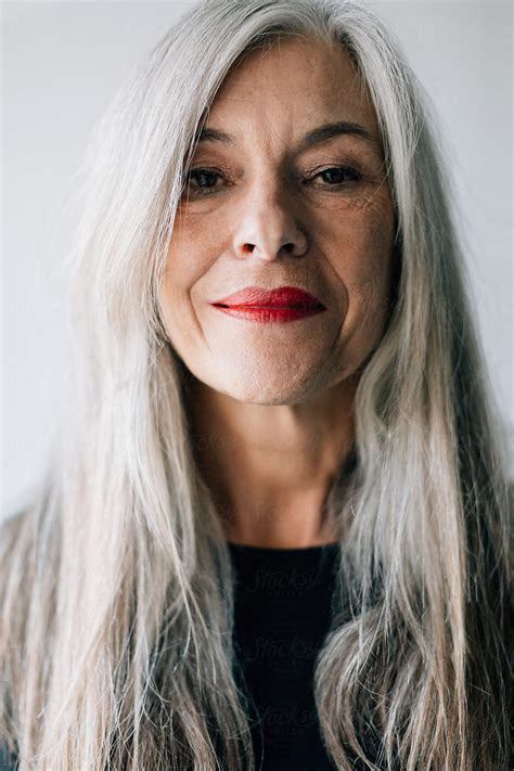 portrait   attractive senior woman  grey long hair