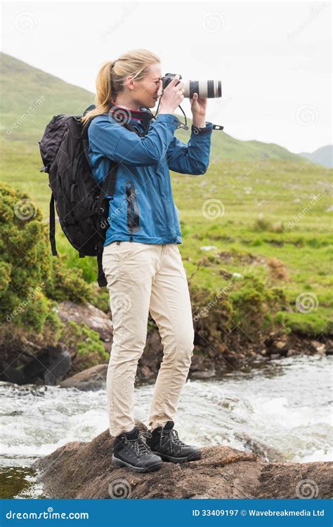 Blonde Woman On A Hike Taking A Photo Stock Image Image Of Adventurer Caucasian