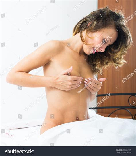 Nude Woman Covering Bosom Hands Bedroom Stock Photo 314464535 Shutterstock