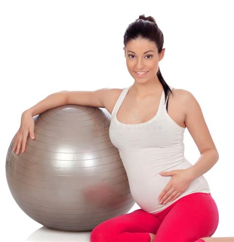 Brunette Pregnant Woman With A Big Ball Doing Exercices Stock Photo