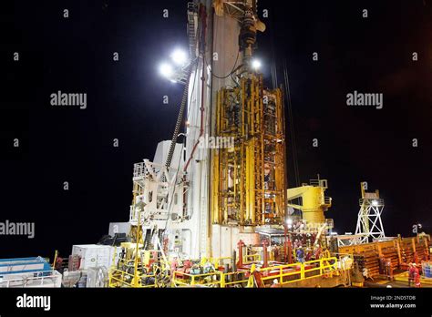 Workers Watch As The Deepwater Horizon Blowout Preventer Stack Yellow